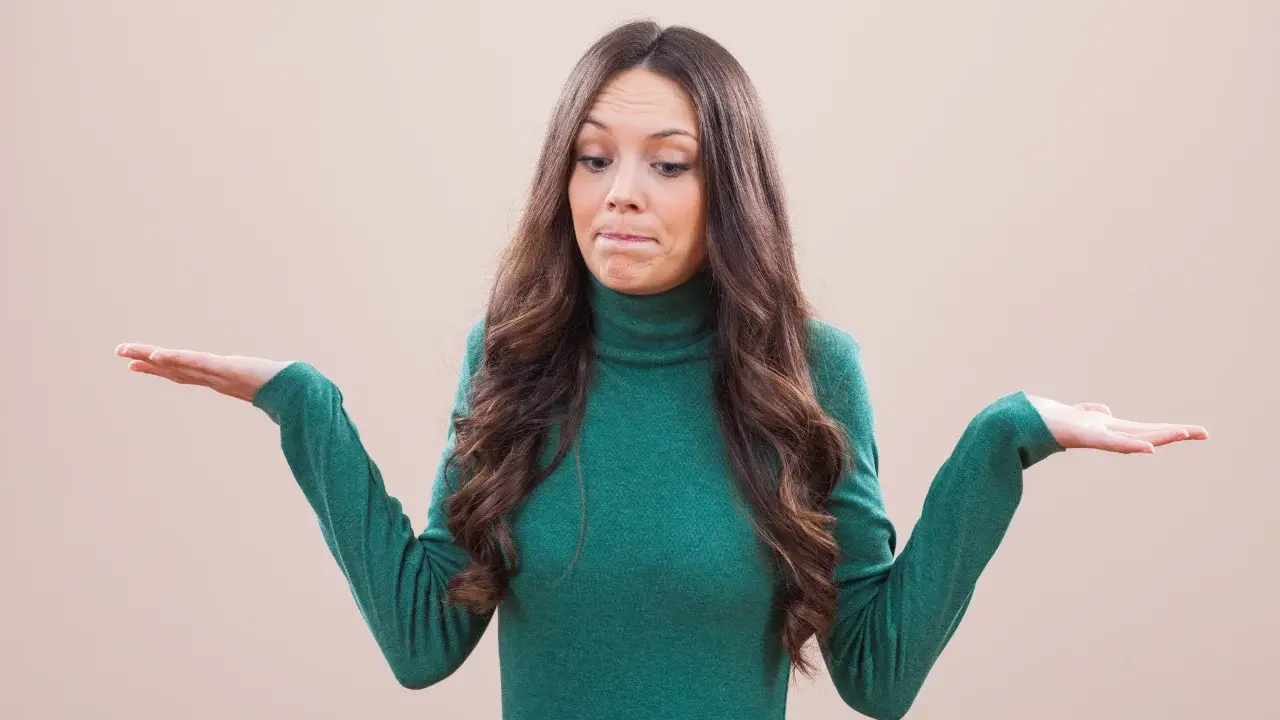 Woman showing uncertainty, illustrating why people don’t buy when messaging lacks clarity