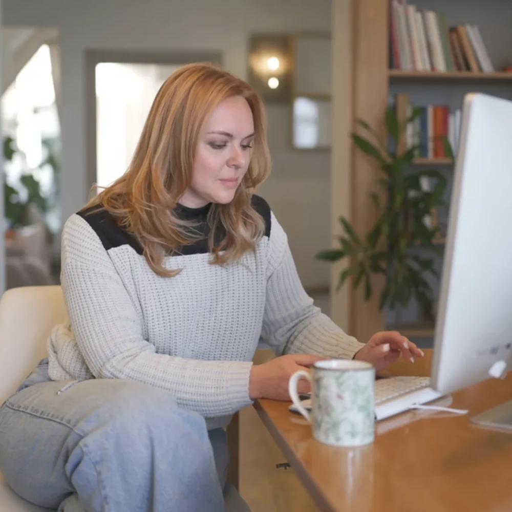 Andrea Working on Computer (2) (1) Andrea Working on Computer (2) (1)